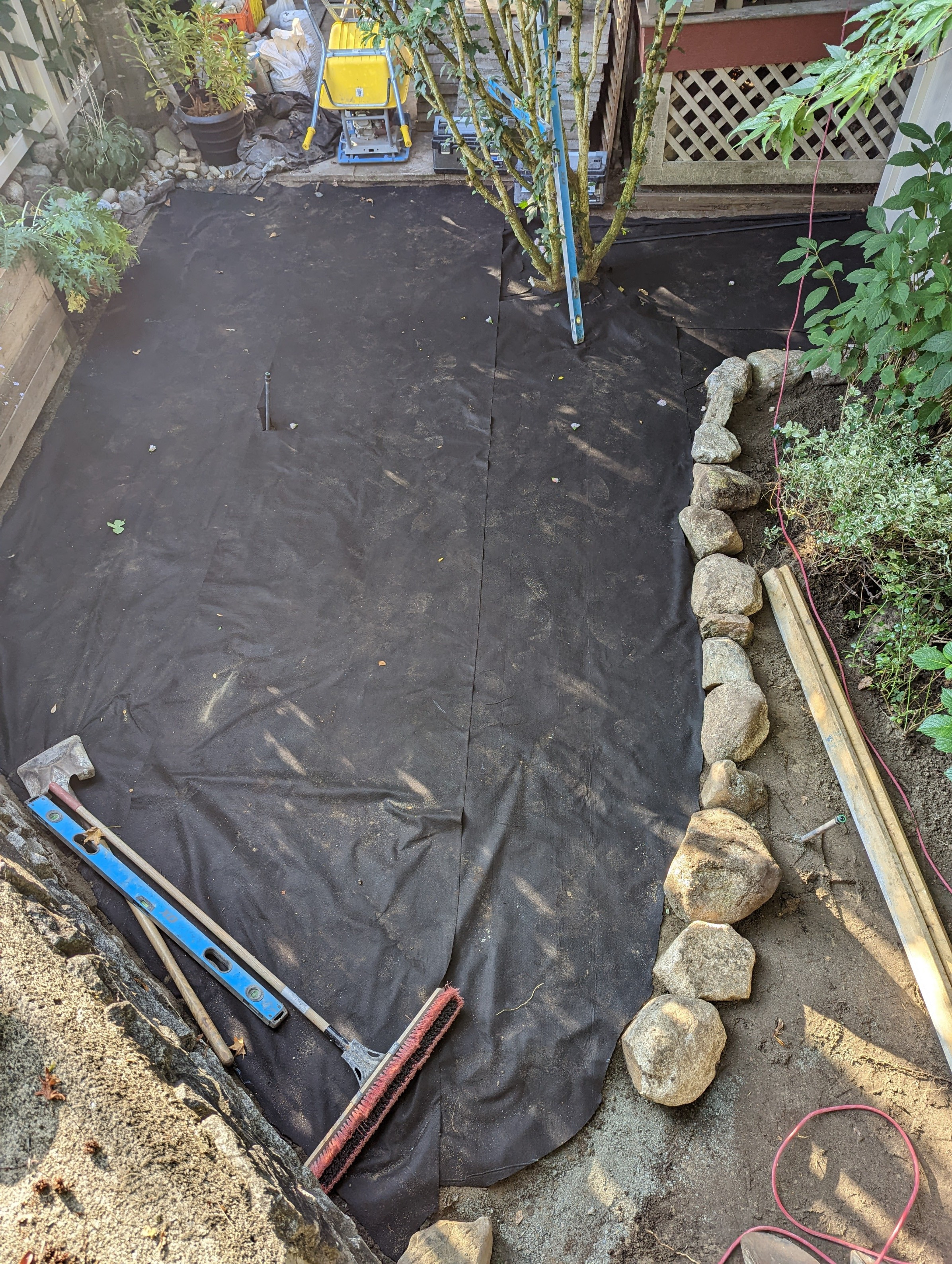 Weed-barrier-being-installed